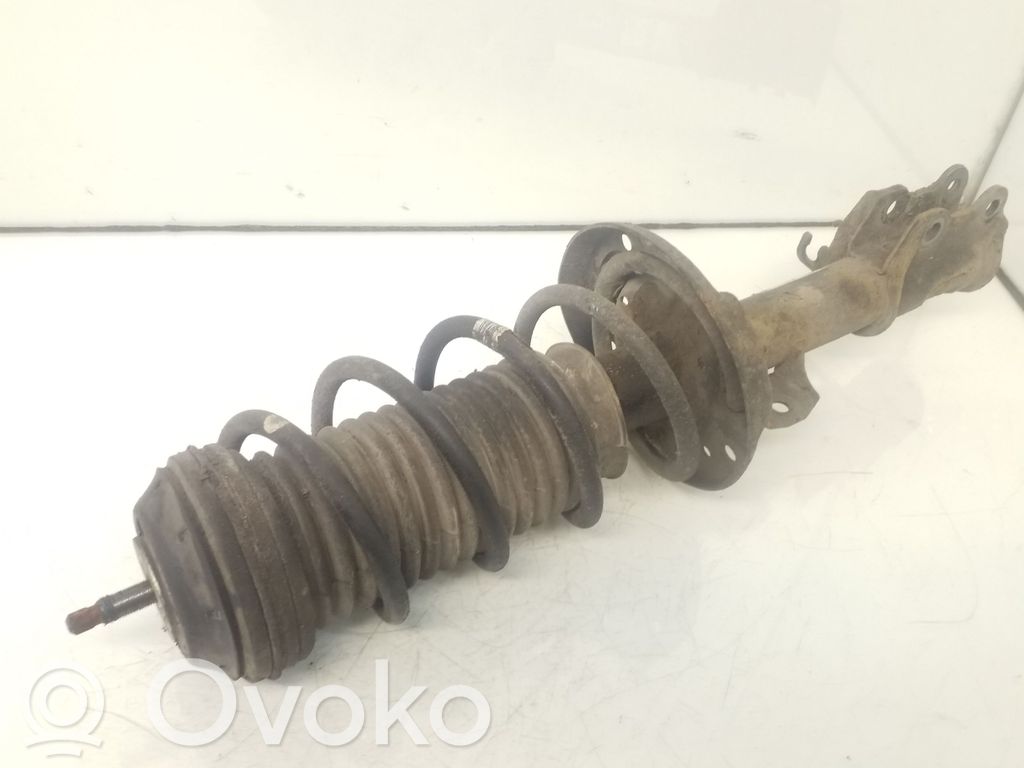 Opel Corsa D Front shock absorber with coil spring 