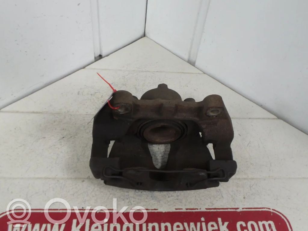Opel Astra G Zacisk hamulcowy przedni 