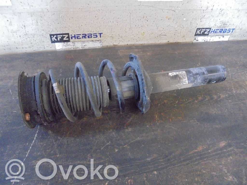Volkswagen PASSAT B8 Amortyzator osi przedniej ze sprężyną 