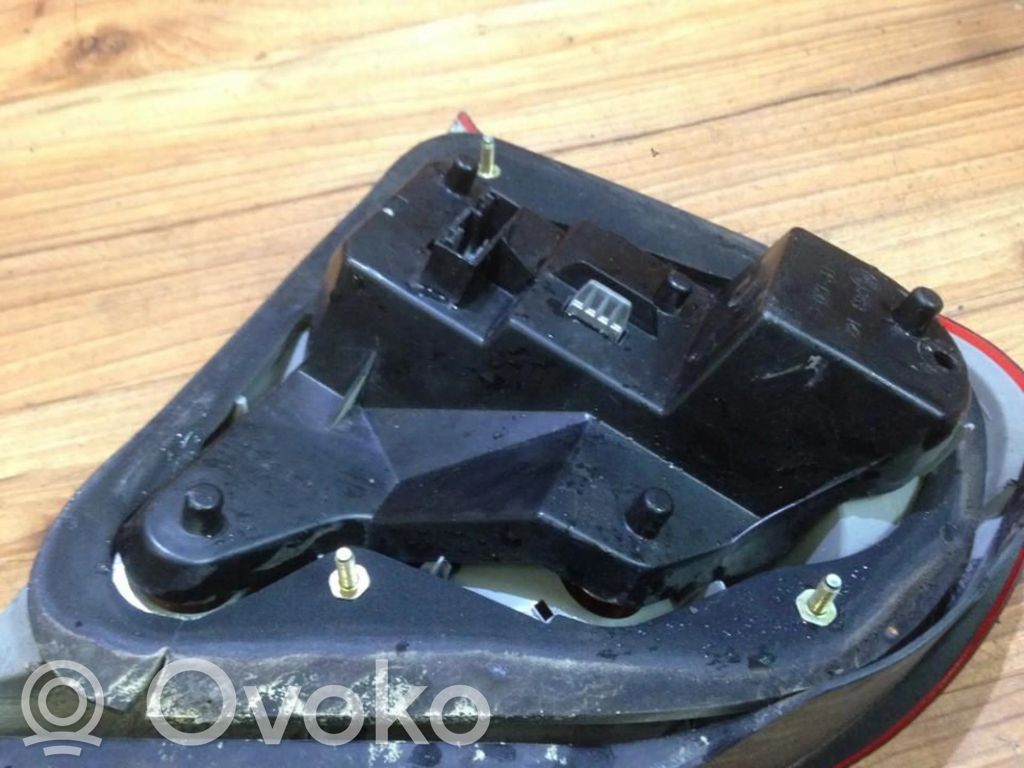 Rover 75 Takavalon polttimon suojan pidike 