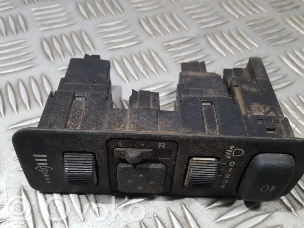 Mitsubishi Carisma Interruptor de control de altura del faro delantero 