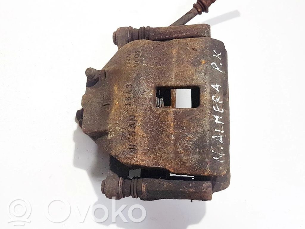 Nissan Almera N16 Zacisk hamulcowy przedni 