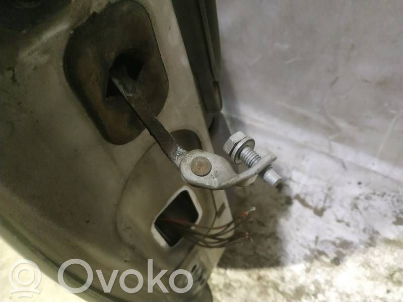 Front door check strap stopper