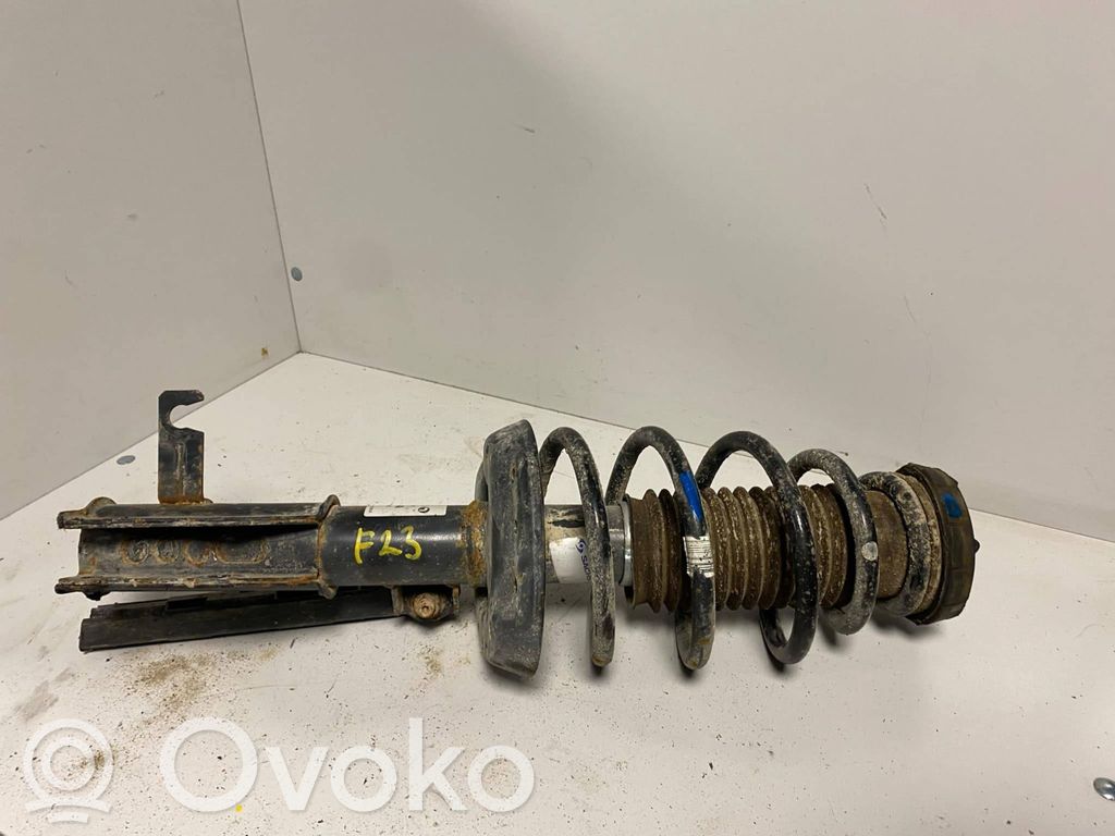 Opel Astra J Amortyzator osi przedniej ze sprężyną 