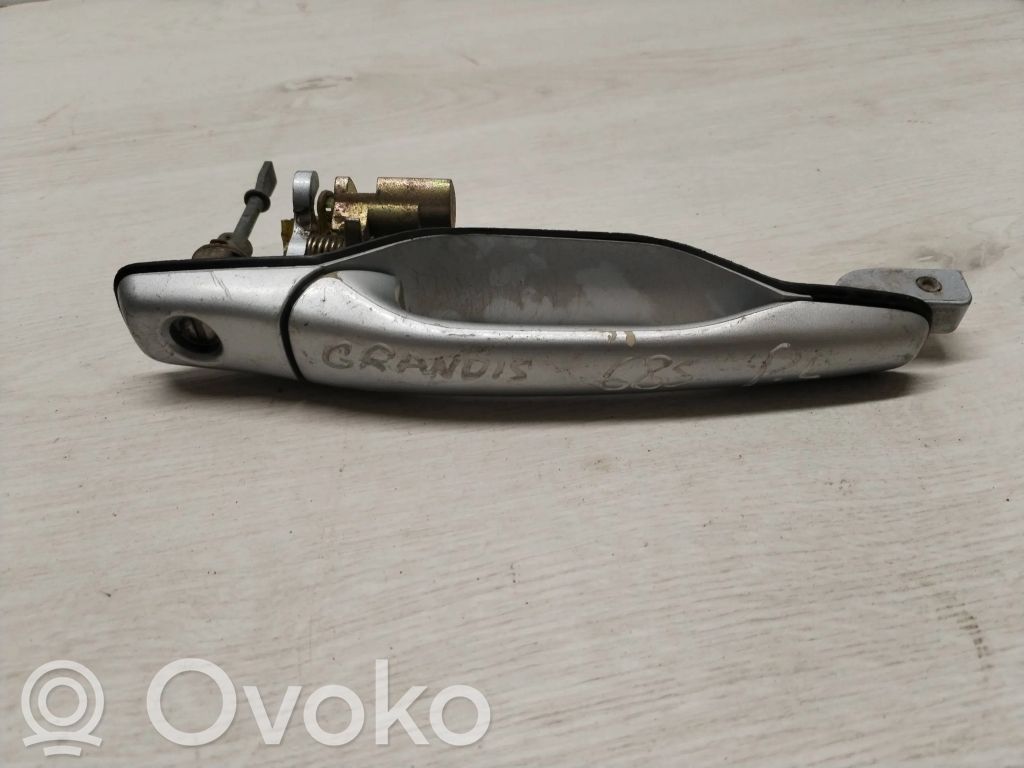 Mitsubishi Grandis Manecilla externa puerta delantera 