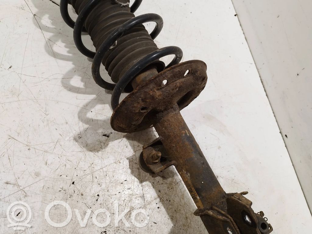 Opel Corsa D Front shock absorber with coil spring 