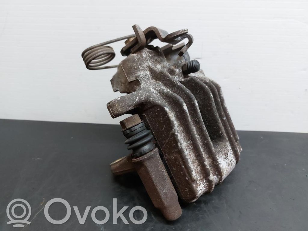 Volkswagen PASSAT B5 Caliper del freno trasero 