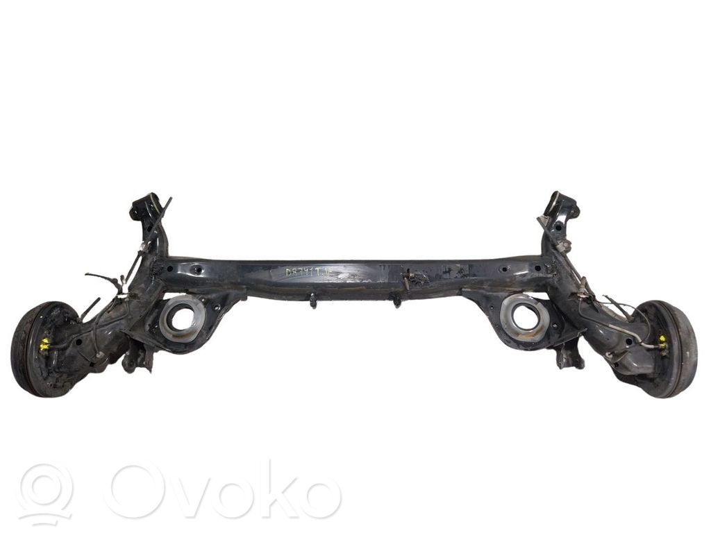 Nissan Micra C+C Belka osi tylnej z reduktorem 