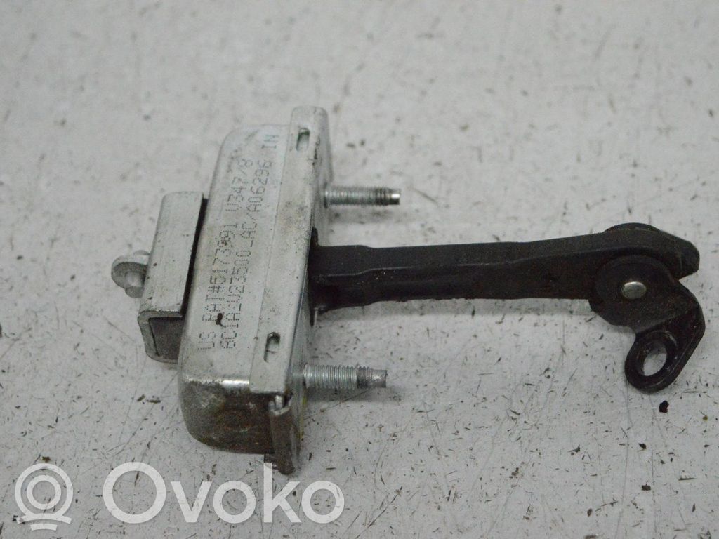 Front door check strap stopper   6C1AV23500AC