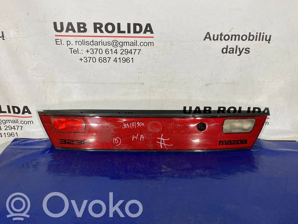 Mazda 323 Trunk door license plate light bar 