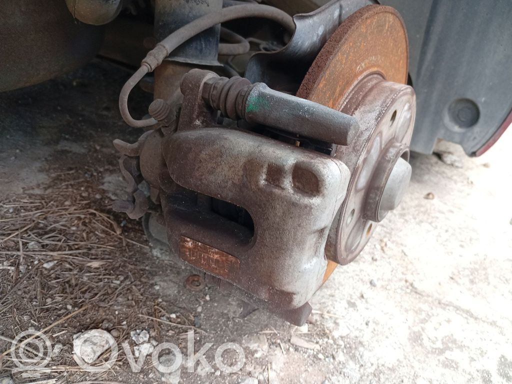 Citroen C4 I Picasso Jarrusatulan tyynyn pidike takana 