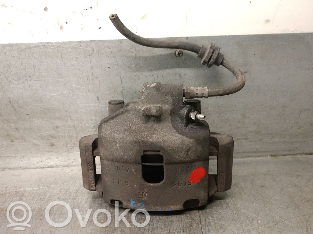 Opel Corsa E Zacisk hamulcowy przedni 
