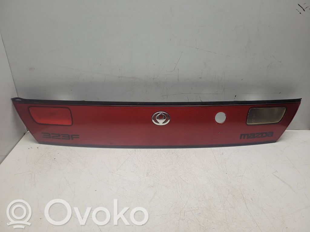 Mazda 323 F Trunk door license plate light bar 