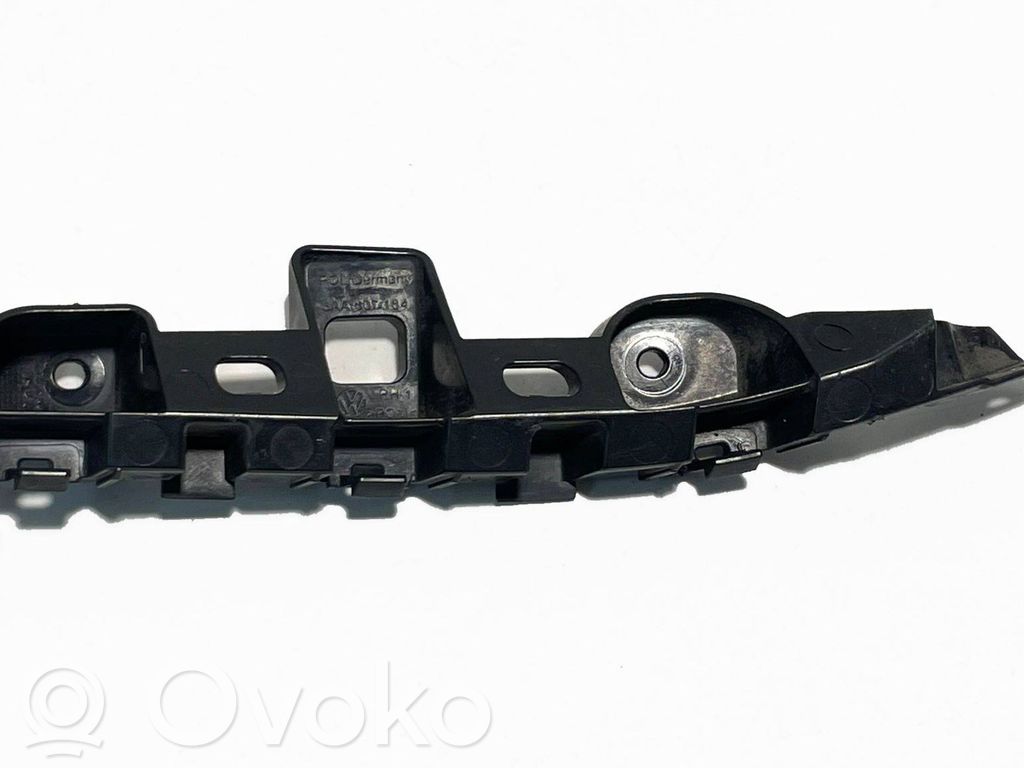Volkswagen PASSAT B7 Uchwyt / Mocowanie zderzaka przedniego 
