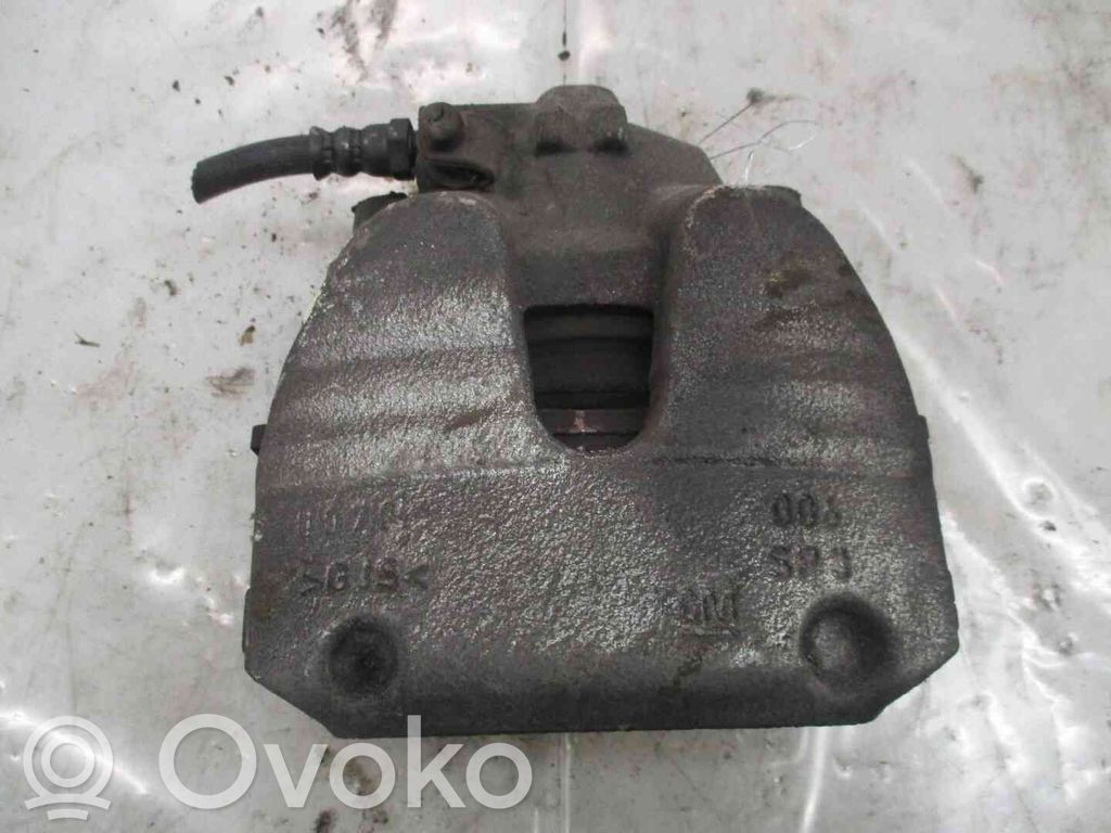 Opel Corsa E Zacisk hamulcowy przedni 