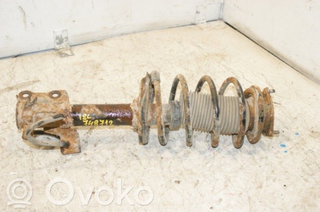 Nissan Almera N16 Amortyzator osi przedniej ze sprężyną 