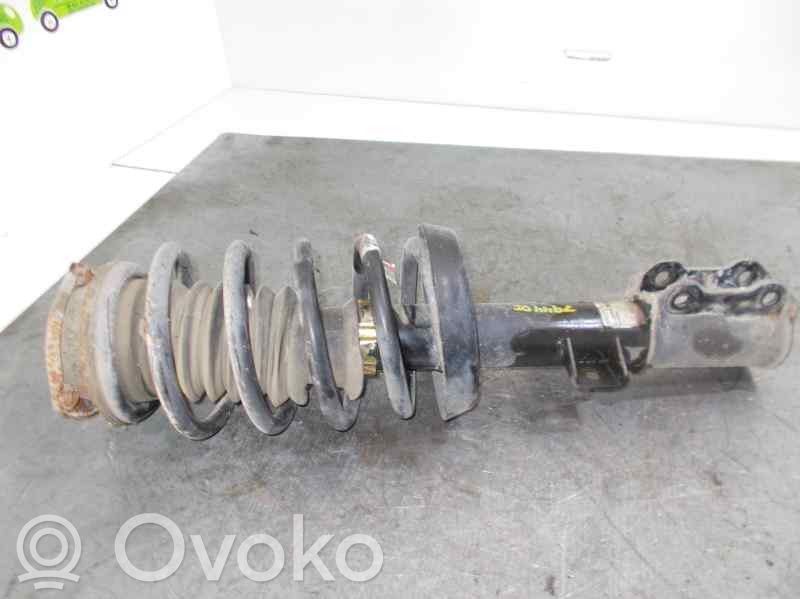 Saab 9-5 Amortyzator osi przedniej ze sprężyną 