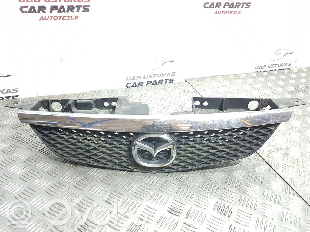 Mazda 323 Front bumper upper radiator grill 