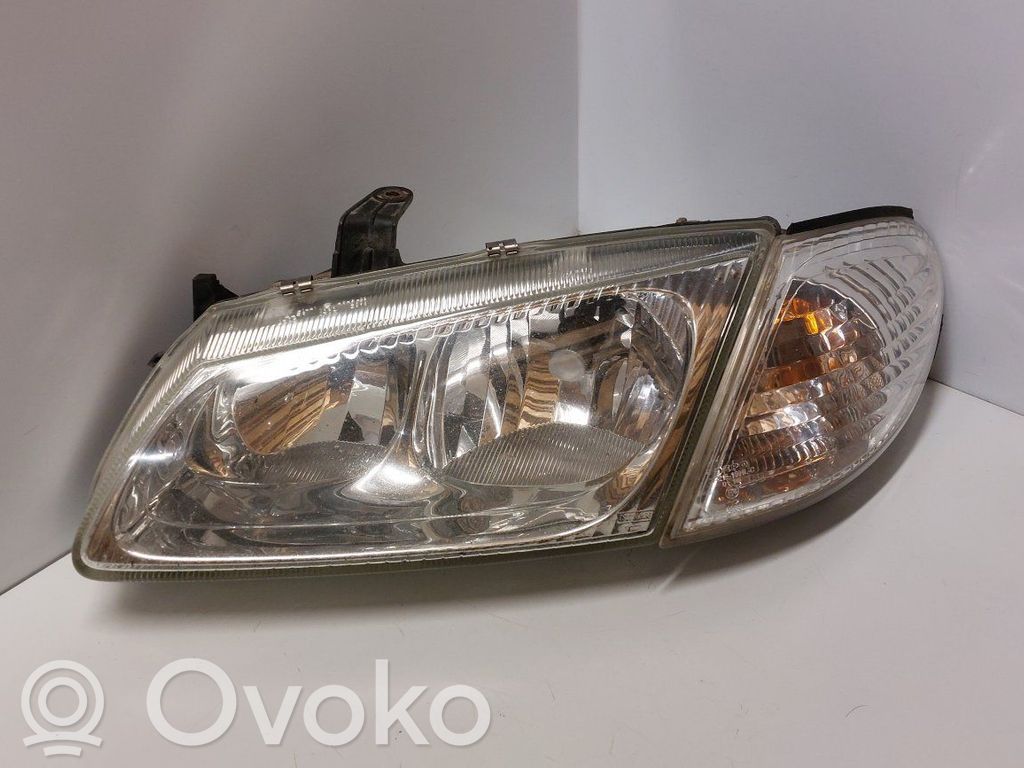 Nissan Almera N16 Lampa przednia 