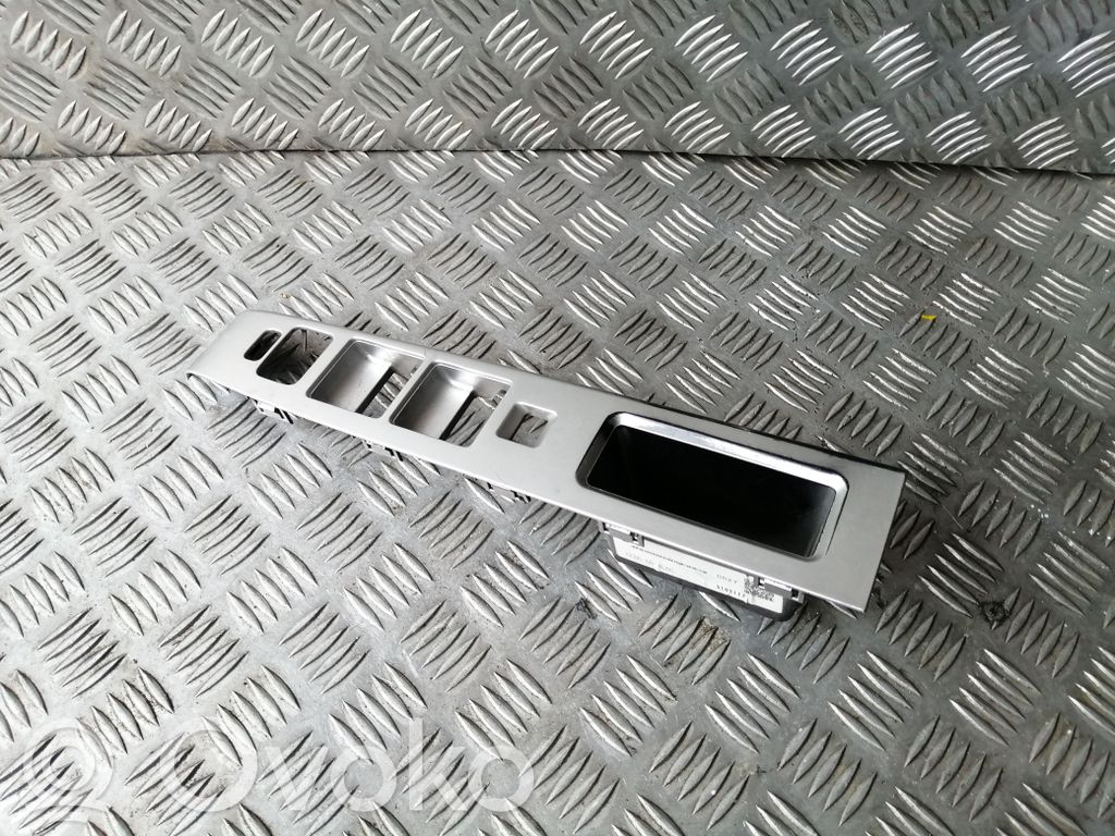Mazda 5 Front door window switch trim 