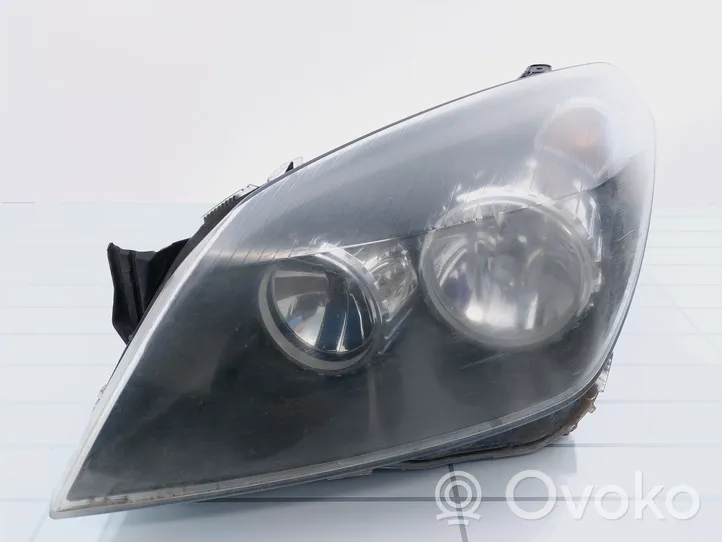 Opel Astra H Lampa przednia 1EG27037021