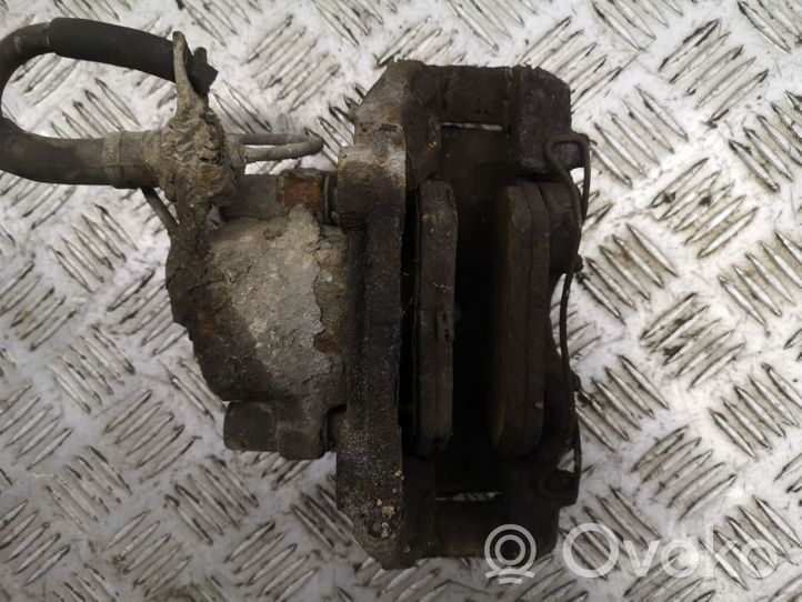 Volkswagen PASSAT B5 Caliper de freno delantero 