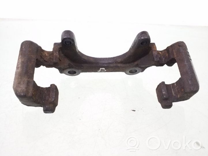 Volkswagen PASSAT B5 Plaquette / support d'étrier avant 