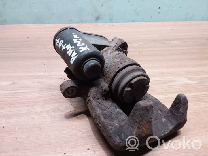 Volkswagen PASSAT B7 Caliper del freno trasero 