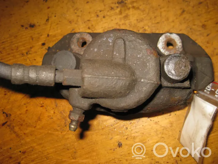 Mazda 121 SM Caliper de freno delantero 