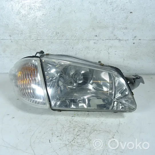 Mazda 323 Lampa przednia 1305235393