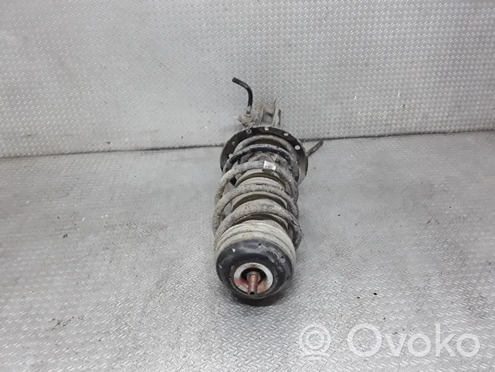 Opel Corsa D Front shock absorber with coil spring 