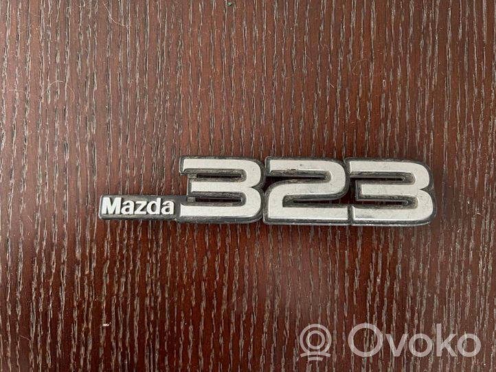 Mazda 323 Logo, emblème de fabricant 