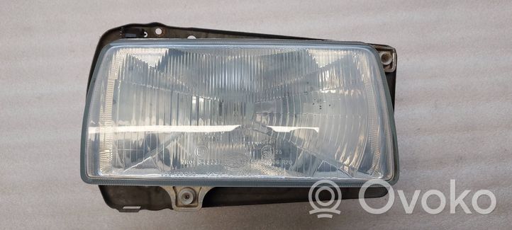 Volkswagen Jetta II Lampa przednia 302129050