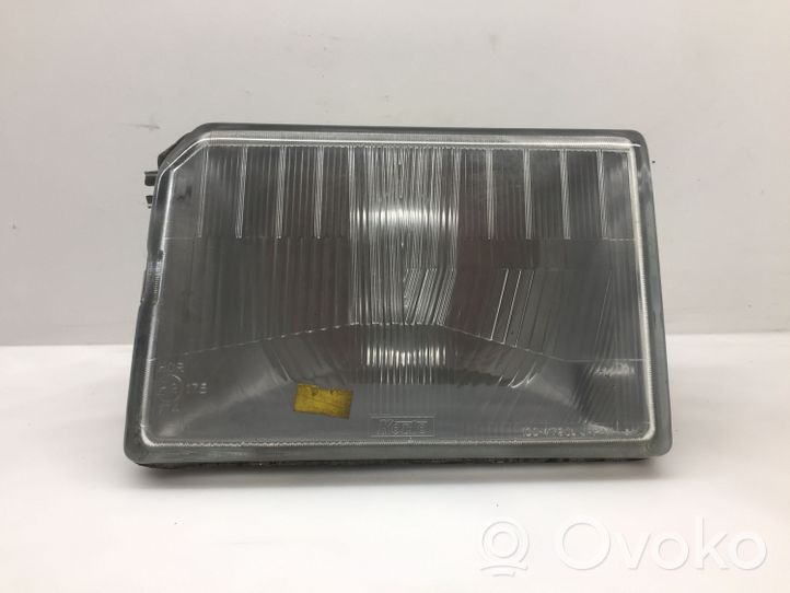 Mazda 323 Lampa przednia 10041790L