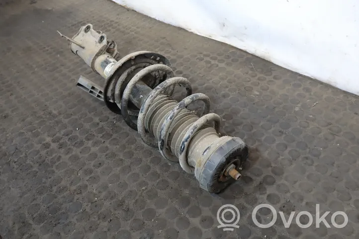 Opel Astra J Front shock absorber with coil spring 