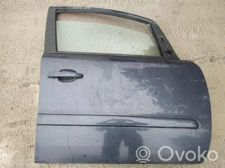 Opel Zafira B Drzwi przednie melynos