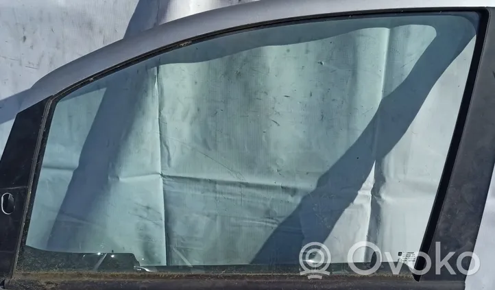 Opel Zafira A Vetro del finestrino della portiera anteriore - quattro porte Pilka