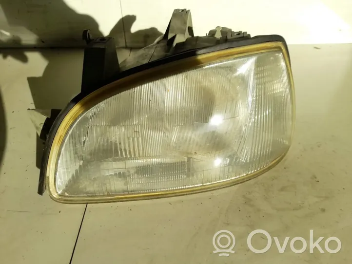 Renault Clio I Lampa przednia 7701042150