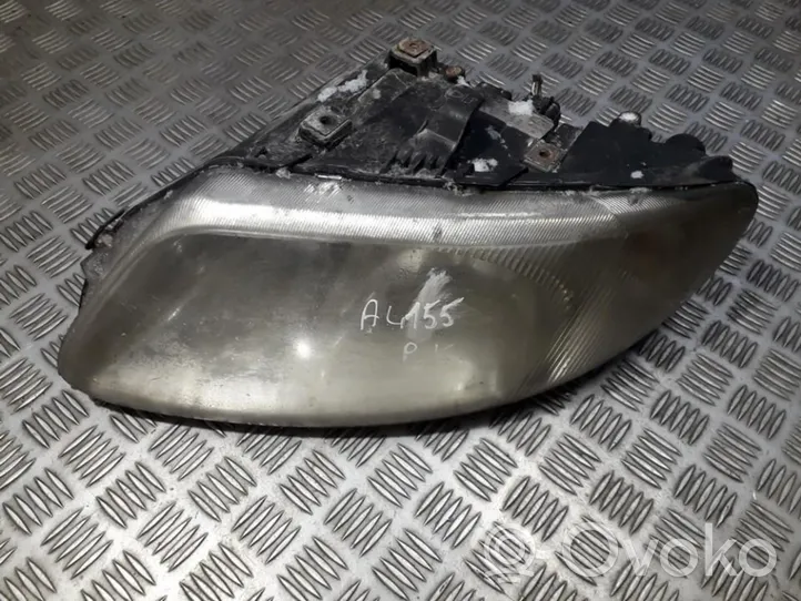 Chrysler Voyager Lampa przednia 04857703abd