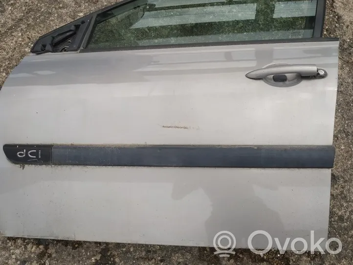 Renault Megane II Rivestimento della portiera anteriore (modanatura) 