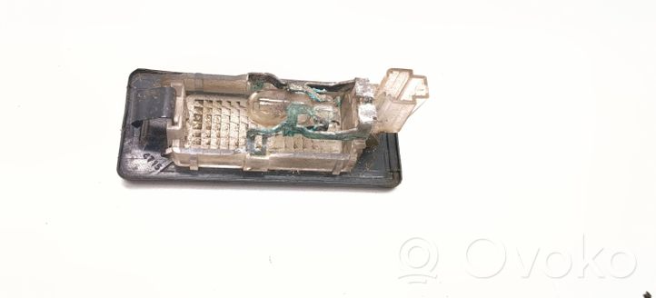 Volkswagen Touran II Lampa oświetlenia tylnej tablicy rejestracyjnej 1T0945021