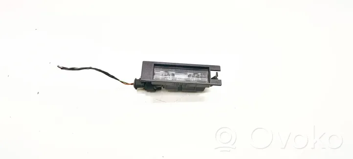 Opel Astra H Lampa oświetlenia tylnej tablicy rejestracyjnej 13139990