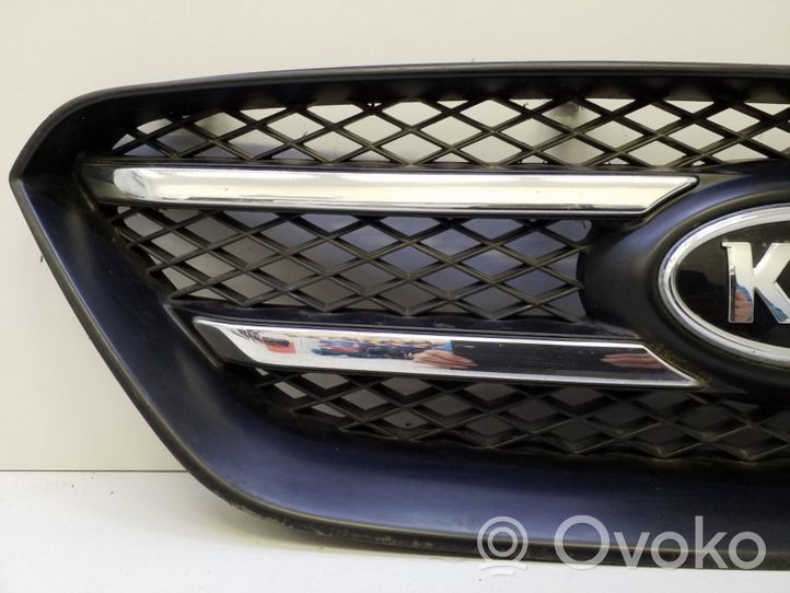 KIA Carens II Grille de calandre avant 8638010000