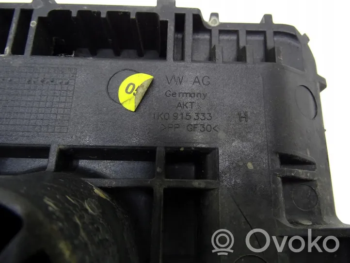 Volkswagen PASSAT B7 Support boîte de batterie 1K0915333H