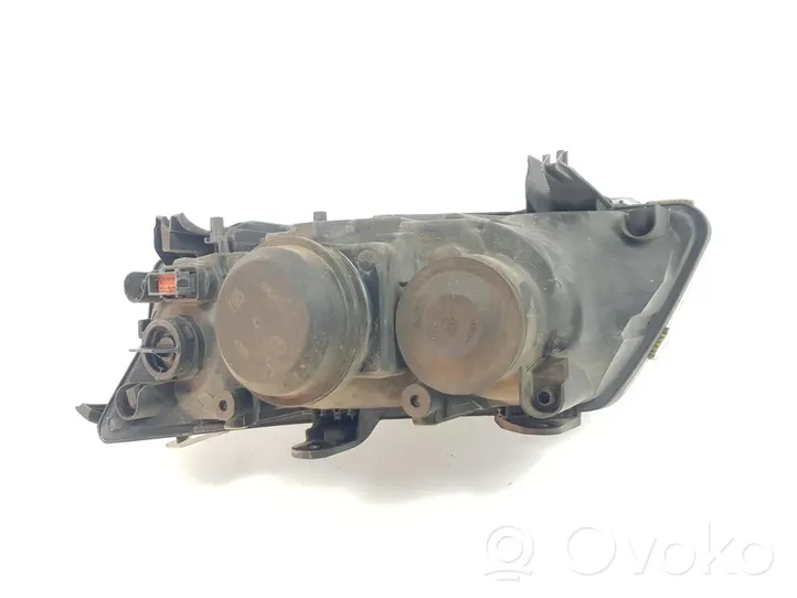 Saab 9-3 Ver2 Lampa przednia 12799352