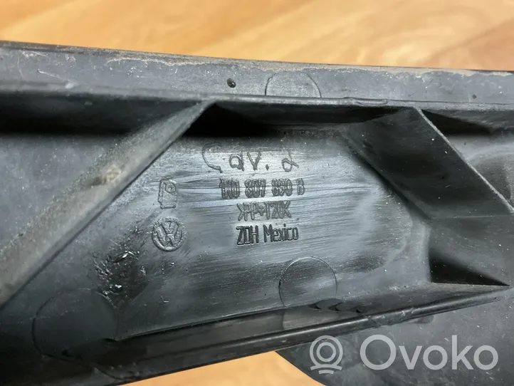 Volkswagen Golf V Uchwyt / Mocowanie lampy przedniej 1K0807899B