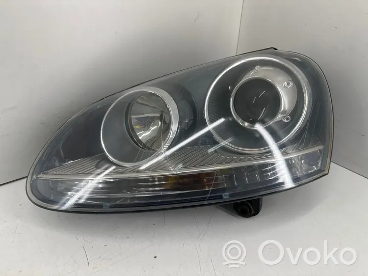 Volkswagen Golf V Lampa przednia 1307329090