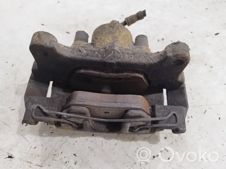 Volkswagen PASSAT B7 Front brake caliper 