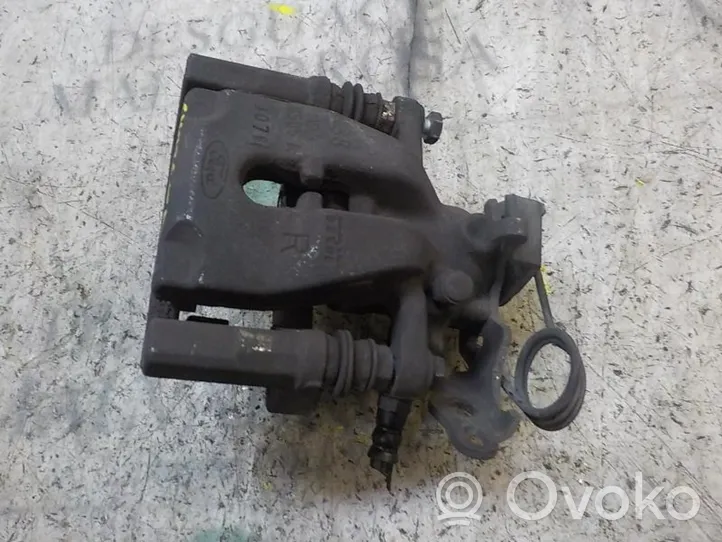 Ford Mondeo MK IV Supporto della pinza del freno posteriore 1738987