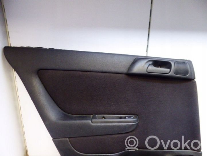 Opel Astra G Garniture panneau de porte arrière 090561531